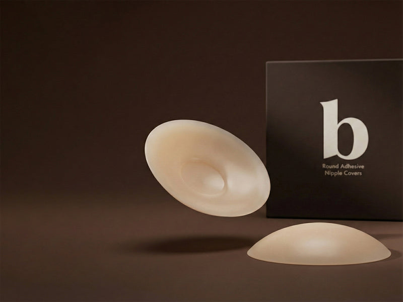 A pair of Grippies in front of a Breasties box.